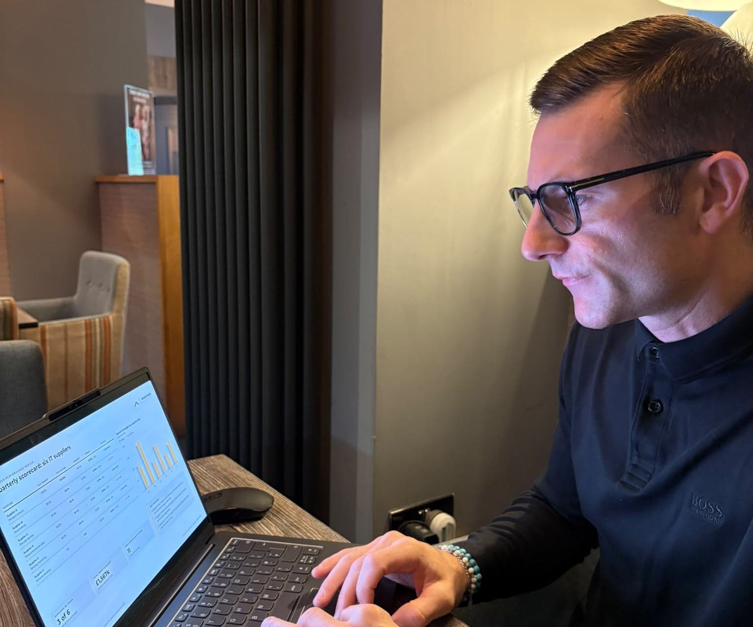 Greg Spanner working through a supplier scorecard on his laptop (illustrative data)